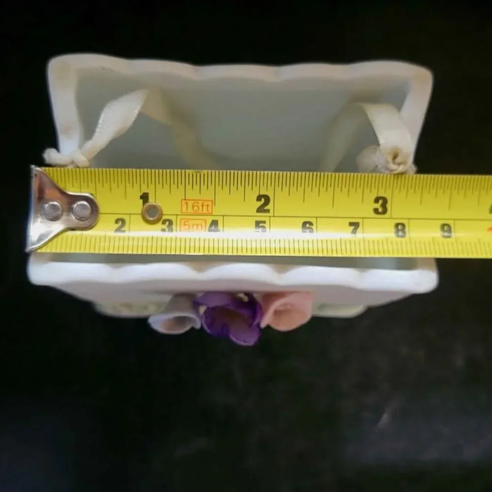 Vintage Porcelain Basket With Floral Embellishments And Decorative Ribbon